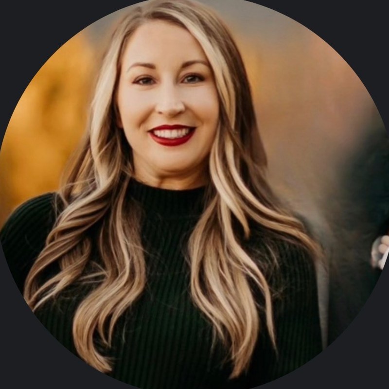 Kyla smiling, wearing a black sweater